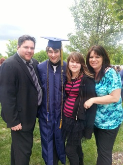 Jason with family after graduation ceremony